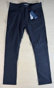 Pantalones Kenneth Cole Tech ligeros elásticos negros para hombre 34x32 nuevos con etiquetas - Imagen 1 de 6