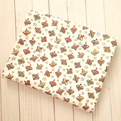 Baum Textile Mills Spinning Tops Cotton Flannel White Multi 1 yard - Image 1 of 4