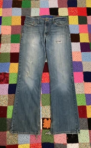 Pantalones de mezclilla azul bajo Levis 527 corte bota para hombre talla 34x34 agujeros en mal estado - Imagen 1 de 12
