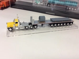 DCP Peterbilt 389 Day Cab Tri Axle w/7 axle Wilson Flat Bed Trailer w/Load. Used - Picture 1 of 3
