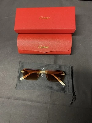 Gafas de sol Cartier montura dorada y perlada unisex Foto 1 de 4