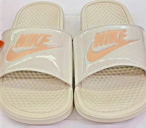 beige nike slides