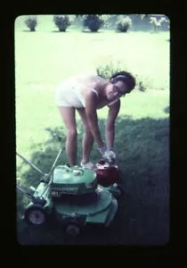 35mm Slide Weird Funny Lady with Lawnmower Cool Summertime Pic Vintage Fun - Picture 1 of 2
