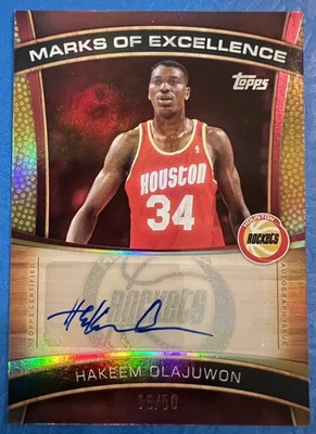 2025-26 Topps Marks of Excellence Auto #ME-HO Hakeem Olajuwon Gold /50 - Image 1 of 2