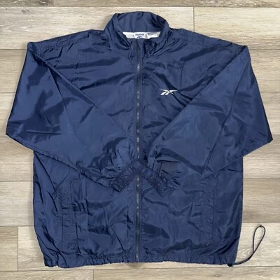 Chaqueta cortavientos vintage Reebok cremallera completa para hombre XL azul marino logotipo forrada de malla Foto 1 de 4