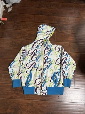 Sudadera con Capucha Súper Rara Rocawear Y2K Aop Cremallera Blanca Verde Azul Dorado Logo GRIAL Grande Foto 1 de 4