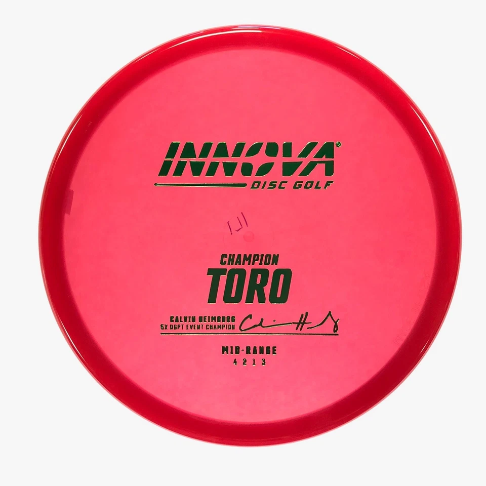 DISC GOLF INNOVA CHAMPION TORO MID-RANGE 171g RED W/ GREEN FOIL HEIMBURG - Image 1 of 1