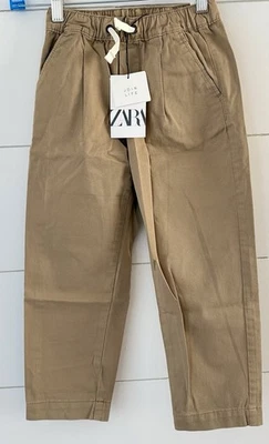 Pantalones chinos caqui holgados Zara para niños talla 7 nuevos con etiquetas Foto 1 de 2