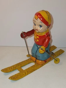 Antiguo Chein Tin Wind Up Invierno Esquiador Niño En Esquís Juguete de Navidad - Imagen 1 de 7