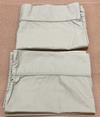 Par de fundas de almohada de resortes estándar Queen de algodón verde liso Foto 1 de 4