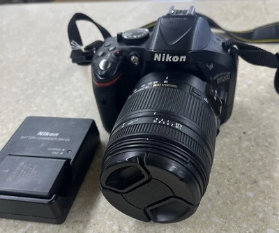 Cámara digital Nikon D5200 24,1 MP SLR con sigma dc 18-250 mm tiene raya en la lente Foto 1 de 4