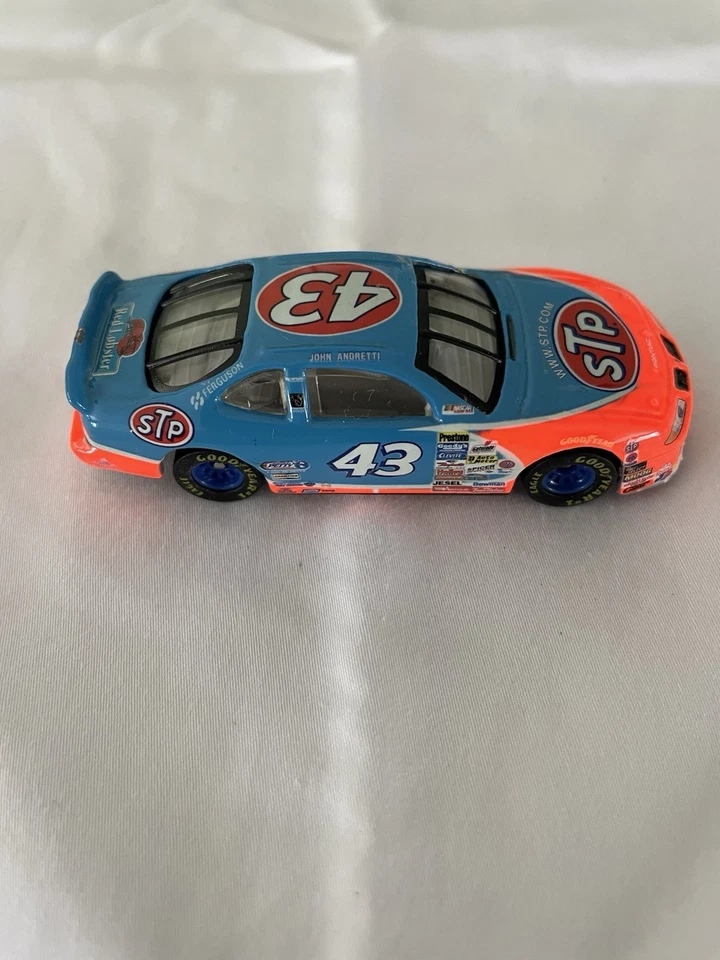 CAMPEONES DE CARRERAS JOHN ANDRETTI 1998 STP PONTIAC GRAND PRIX NASCAR 1/64 COCHE Foto 1 de 1