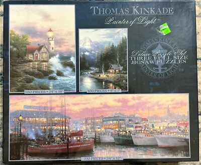 Thomas Kincade 3 Puzzle Set New! Factory Sealed. Cottage Boat Lighthouse 3632-5 - Image 1 of 2