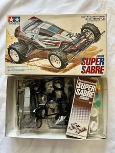 1988 TAMIYA JUNIOR SUPER SABRE 4WD 1/32 RACER MINI SERIES 10 VINTAGE UNASSEMBLED - Picture 1 of 6