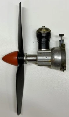 Vintage Cox 049 model airplane engine w/ Fuel Tank, Spinner, Propeller - Image 1 of 4