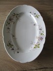 Plat ovale  en  porcelaine  Limoges ? Pouyat ? décor fleurs  ""