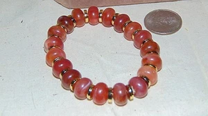 PULSERA ELÁSTICA CUENTAS COLOR ÁMBAR Y DORADO CLARO Y OSCURO - Imagen 1 de 5