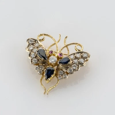 Broche mariposa diamante 0,80 quilates en oro de 18 quilates Foto 1 de 4