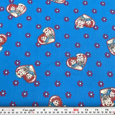 Daisy Kingdom Raggedy Ann Classic Allover Springs Blue Cotton by the HALF YARD - Image 1 of 2