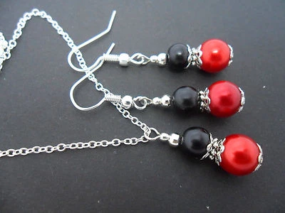 A RED AND BLACK GLASS PEARL  NECKLACE & EARRING SET. NEW. - Image 1 of 2
