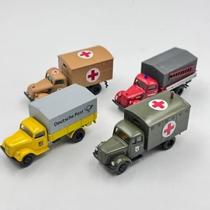 Cars collection (4 pcs) WWII German Civil & Medical Service Trucks scale 1/87 H0 - Picture 1 of 11