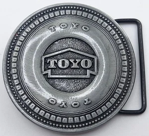 Hebilla de cinturón Toyo Tire Canada Century tono plateado de colección - Imagen 1 de 4