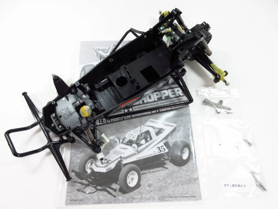 Kit de chasis saltamontes Tamiya 1/10 con motor 380 sin usar y sellado QQ8 Foto 1 de 4