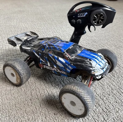 Traxxas Mini E-Revo 1/16 Scale Remote Truck VXL RTR Dirty Untested For Parts - Image 1 of 4