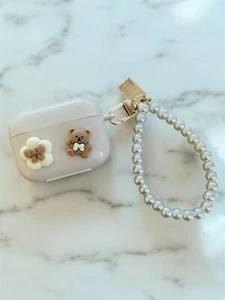 Kit de funda AirPods Pro y AirPods 2 Teddy beige marrón con colgante de cuentas niña - Imagen 1 de 8