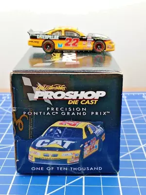 Ward Burton #22 CAT Dealers 2000 NASCAR Ertl Pro Shop 1:64 BRAND NEW - Image 1 of 4
