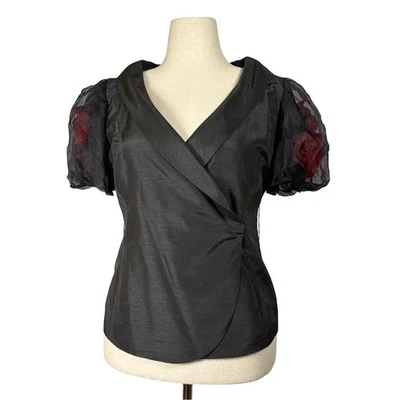 Top Victor Costa negro envolvente con mangas abullonadas transparentes y detalle rosa 3D | Talla 10 Foto 1 de 4