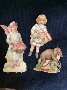 3 Lindos Álbumes de Recortes Vintage Troquelados Elefante Juguete Nieve Ángel Niña Muñeca Victoriana - Imagen 1 de 3