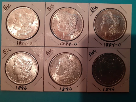 Lot Of 6 Morgan Silver Dollars, 3 1884-O BU, & 3 1896, 1 BU & 2 AU Cover