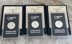 (3) Münzlot 1882-CC 1883-CC UND 1884-CC GSA Silber Morgan Dollars mit Box & COA - Bild 1 von 2