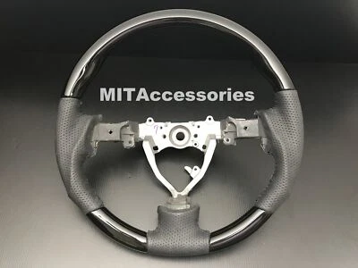 Volante de cuero genuino piano negro deportivo para Toyota FJ Cruiser 2006-2017 Foto 1 de 4