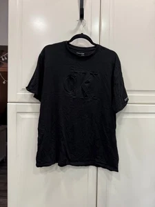 T-shirt Calvin Klein nera con logo CK in rilievo L/G - Foto 1 di 3