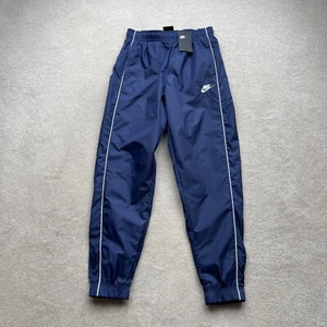 Nike Unisex Cuffed Tapered Shell Tracksuit Bottoms Blue Size XS / S W26-29” NWT - Picture 1 of 16