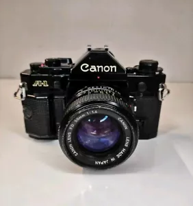 Canon A-1 fotocamera reflex pellicola 35mm + obiettivo Canon FD 50mm 1.4 - perfettamente funzionante - Foto 1 di 19