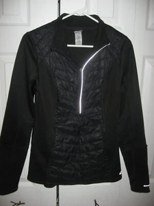 Chaqueta cortavientos mediana CHAMPION elástica semi acolchada negra nueva sin etiquetas - Imagen 1 de 3