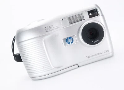 HP PHOTOSMART 320 2.1 MP DIGITAL CAMERA. TAKES SD CARDS & AA BATTERIES (NEITHER - Image 1 of 4