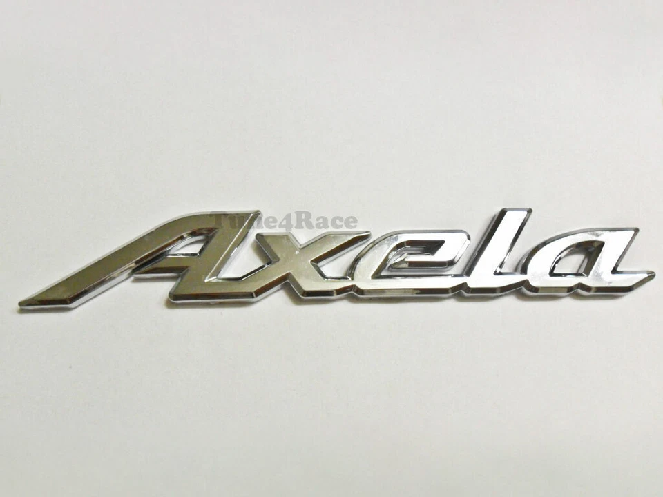Axela Logo Emblem Silver Mazda OEM Genuine Stock trunk  badge decal symbol 626 - Image 1 of 1
