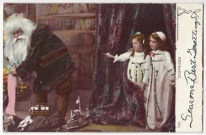 1906 Navidad SANTA CLAUS, niñas viendo medias de relleno de Papá Noel, postal - Imagen 1 de 2