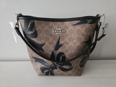 Coach CY651 City Bucket Bag In Signature Canvas with Bow Print Crossbody Tan NWT - Image 1 of 4