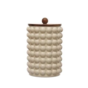 6.75 Inches Round Stoneware Canister with Raised Dots and Acacia Wood Lid, Wh... - Picture 1 of 9
