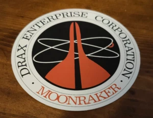 PROP - James Bond - Moonraker - Drax Logo Drinks Coaster - Picture 1 of 3