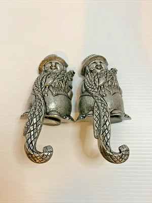 Par de perchas de metal fundido para muñeco de nieve de Navidad Foto 1 de 4