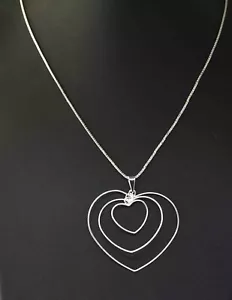 ARGENTO STERLING - COLLANA CIONDOLO OSCILLANTE TRIPLO CUORE - Foto 1 di 5
