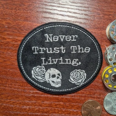 Dark Humor Patch Never Trust The Living Quote Embroidered Iron On Patch 3x2.5" - Image 1 of 3