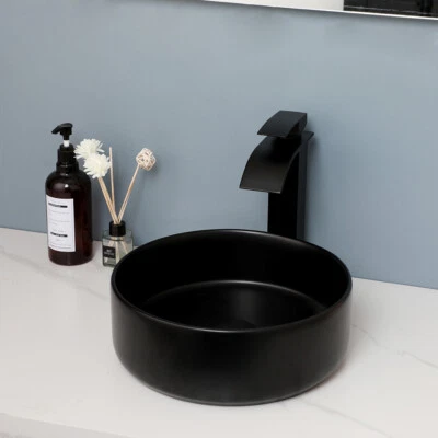 Juego de grifo de lavabo de cerámica negra con lavabo redondo de baño Foto 1 de 4