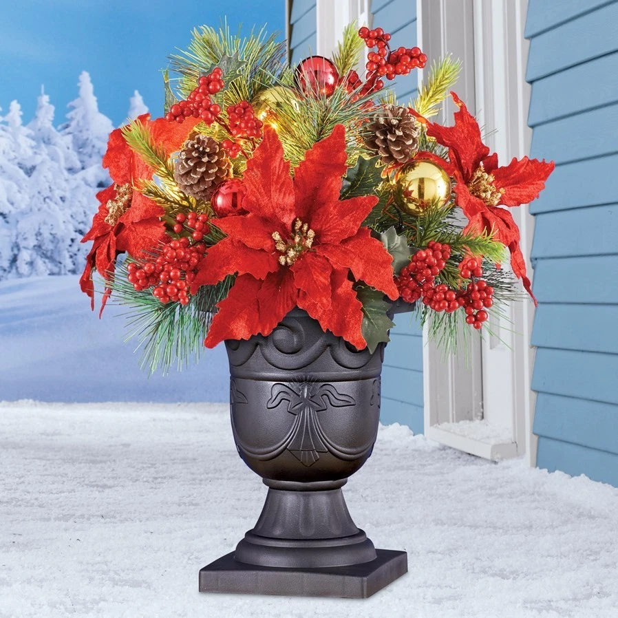 Arreglo floral de pascua y adornos navideños con luz solar con florero Foto 1 de 1